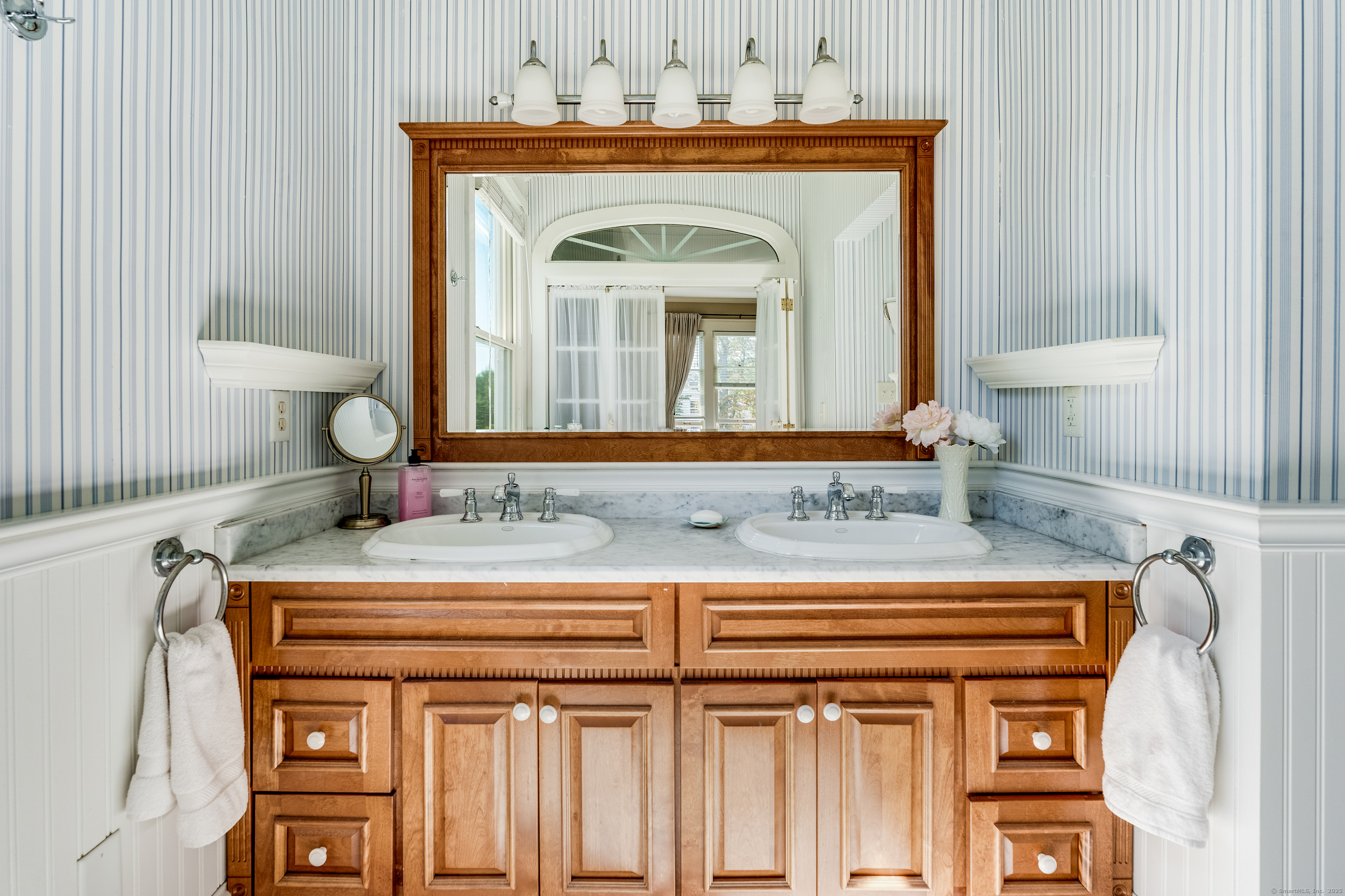 27 Church Street Groton, CT 06340 - Photo 26 of 37 a bathroom with a sink and a mirror