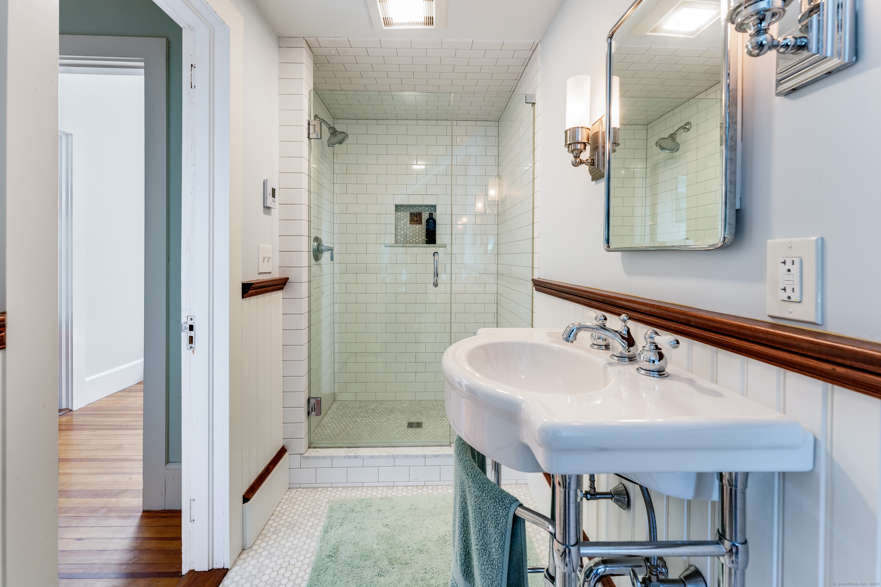 27 Church Street Groton, CT 06340 - Photo 34 of 37 a bathroom with a sink and a mirror