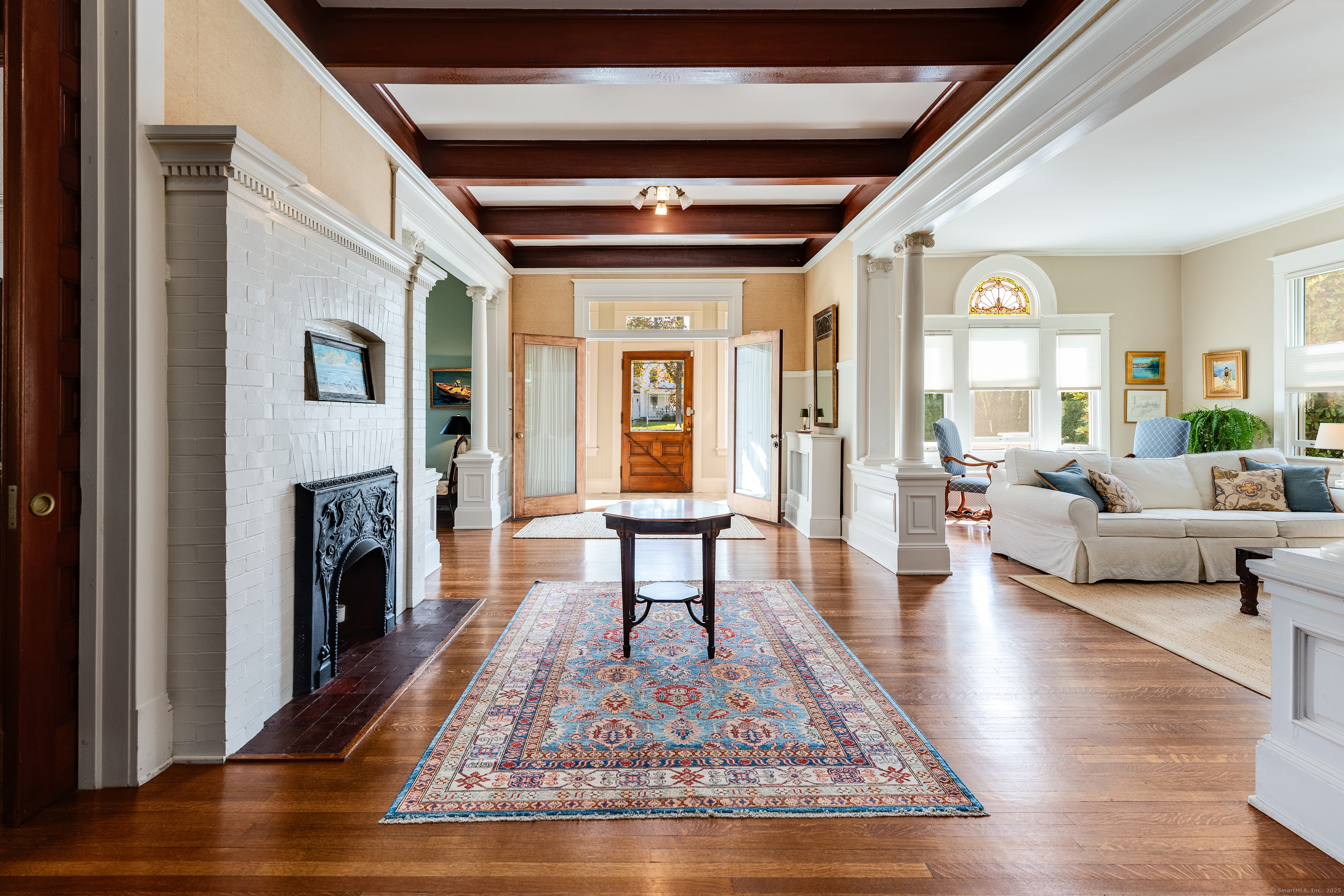 27 Church Street Groton, CT 06340 - Photo 6 of 37 a living room with furniture fireplace and wooden floor