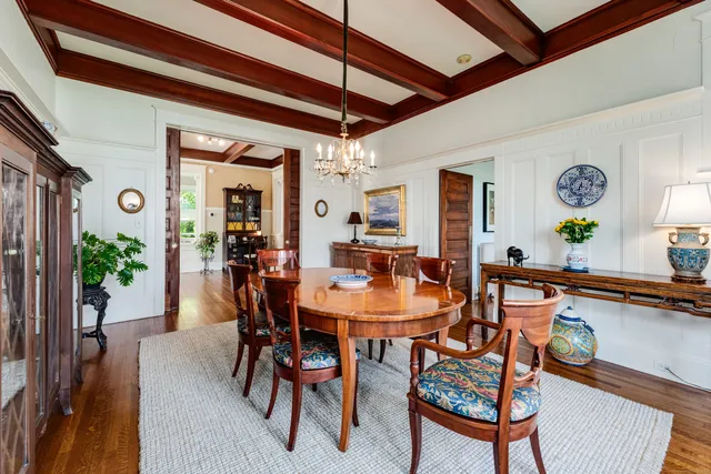 a dining room with a table and chairs
