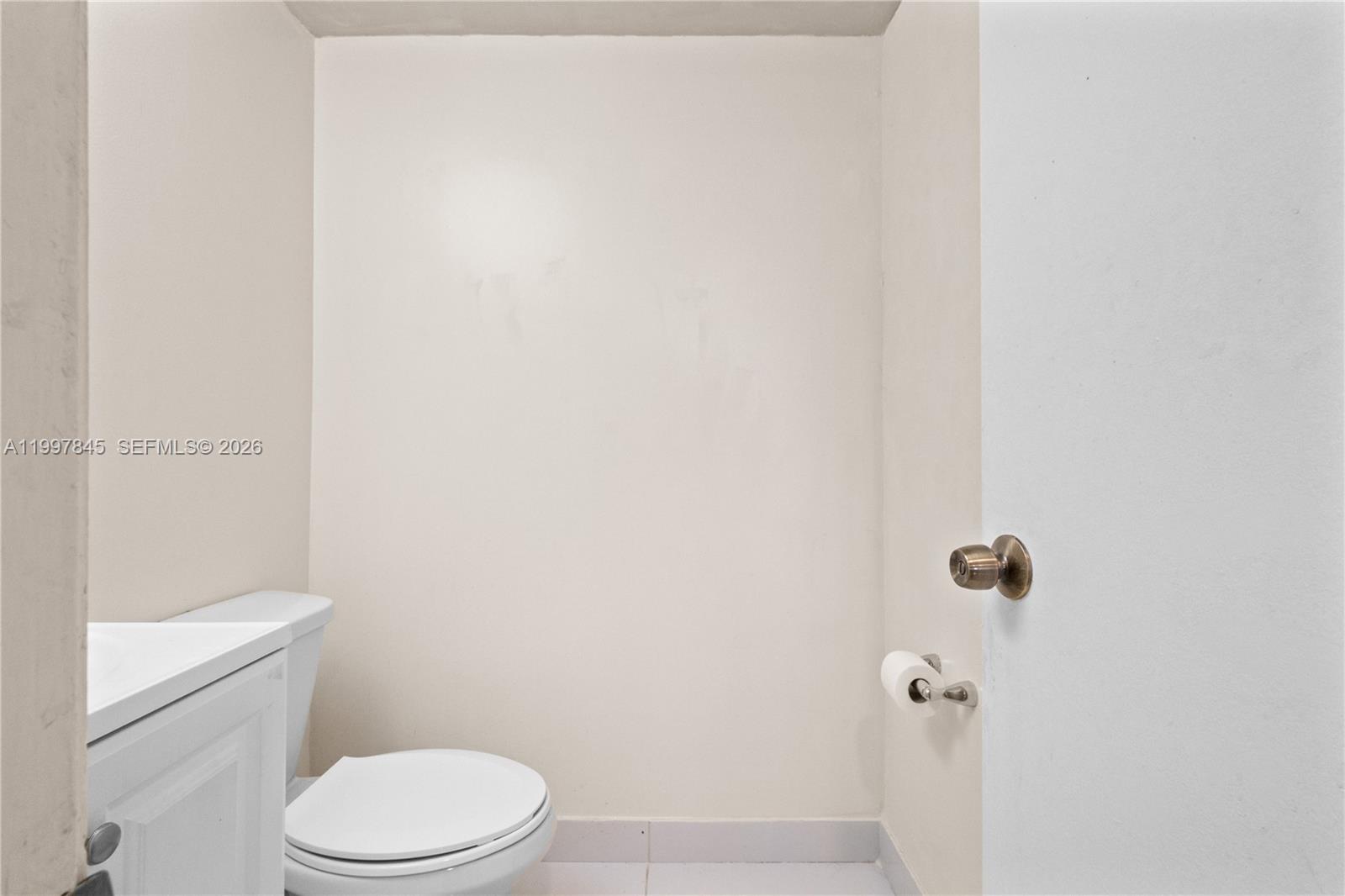 6211 Southwest 138th Court, Unit B Miami, FL 33183 - Photo 19 of 24 a white toilet sitting next to a shower
