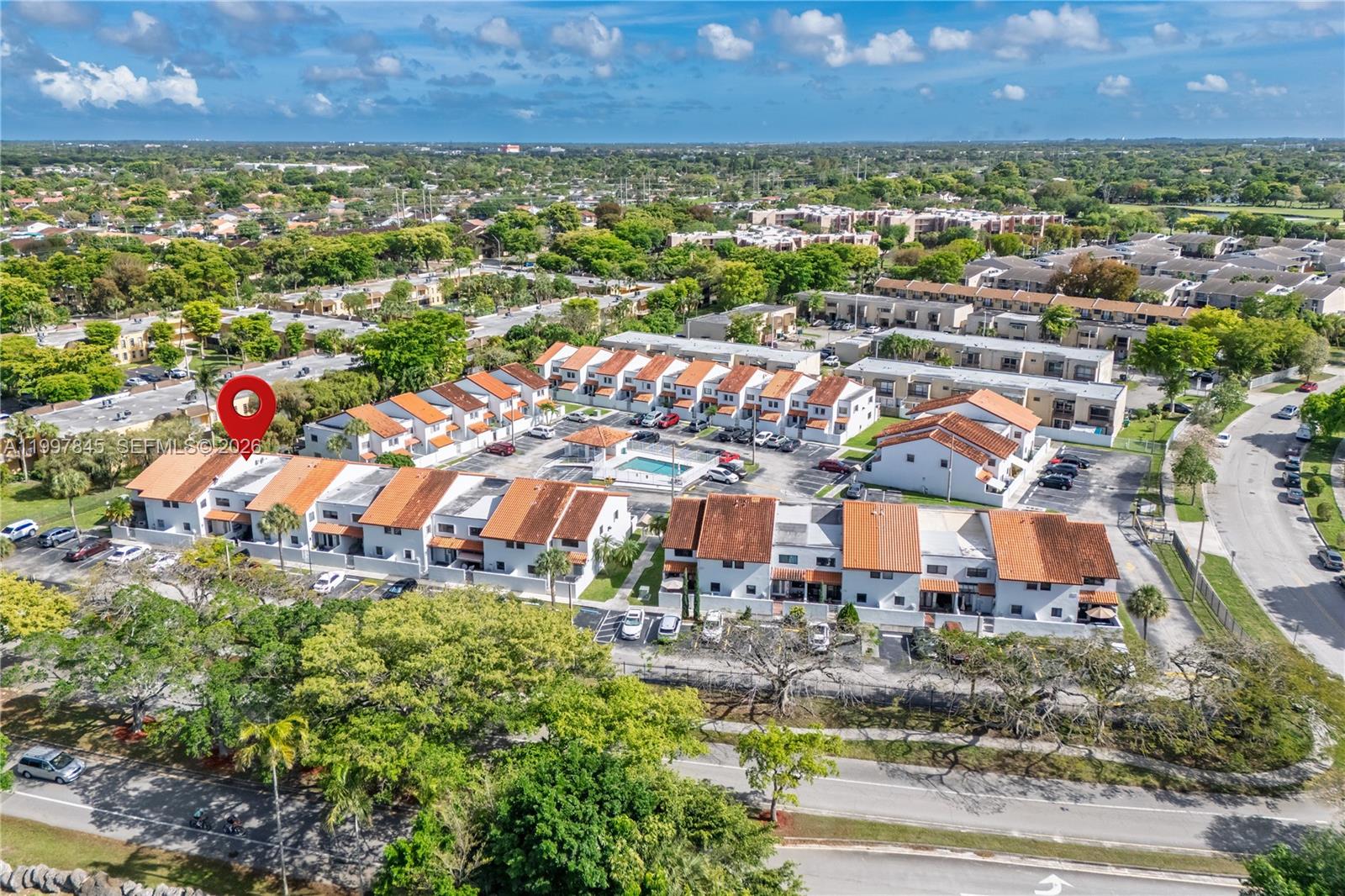 6211 Southwest 138th Court, Unit B Miami, FL 33183 - Photo 21 of 24 an aerial view of residential building and lake