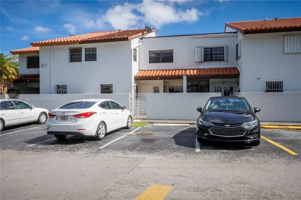 a front view of a house with parking