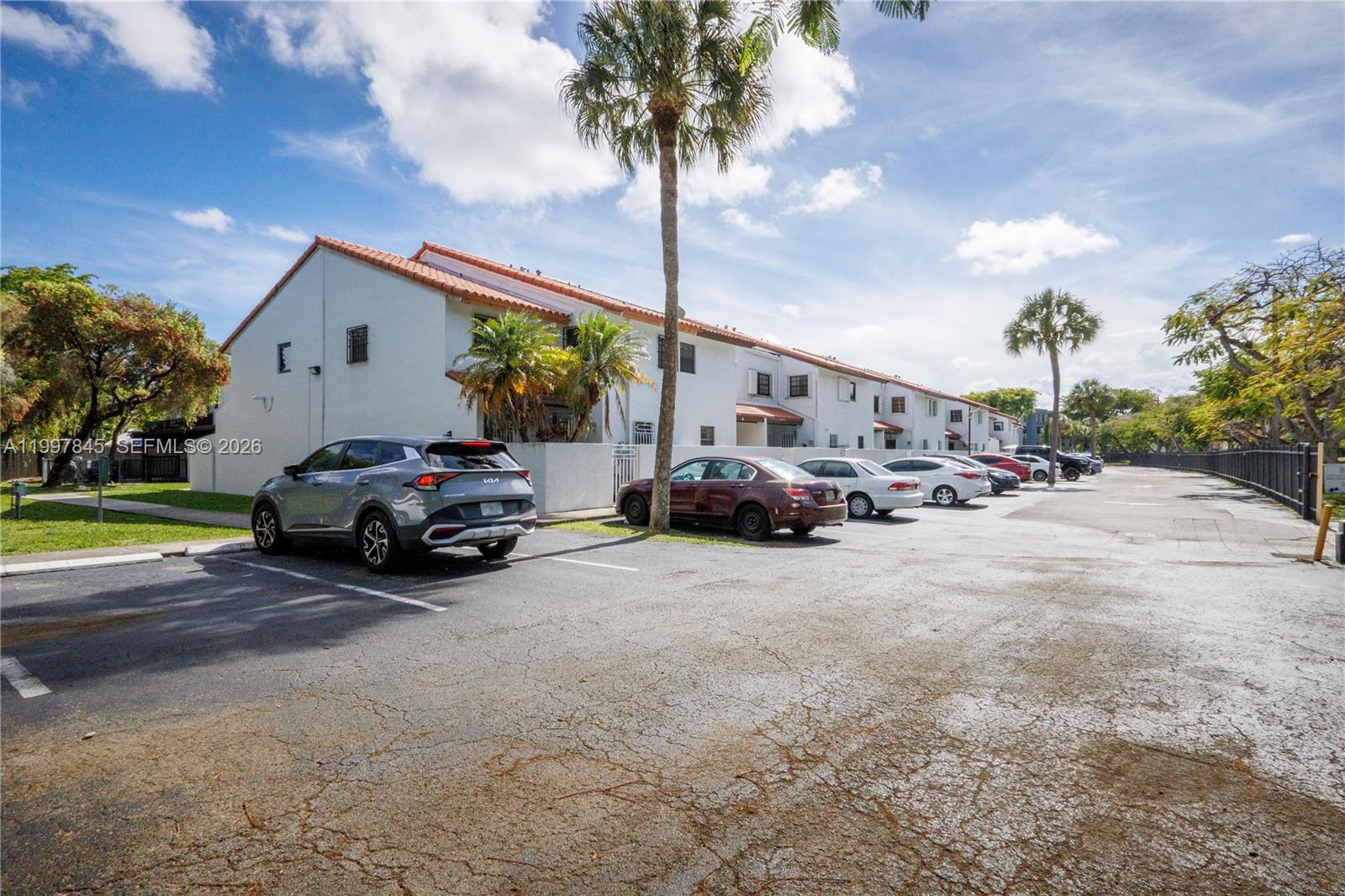 6211 Southwest 138th Court, Unit B Miami, FL 33183 - Photo 23 of 24 a view of car parked in front of house