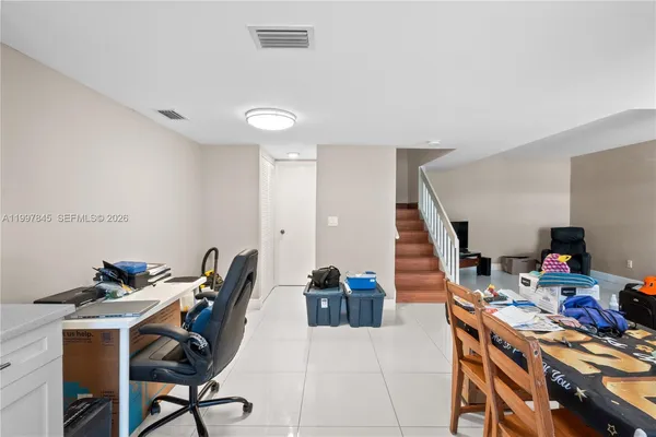 a view of a workspace with furniture and toys