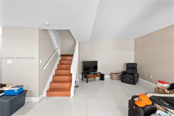 a room with stairs and furniture
