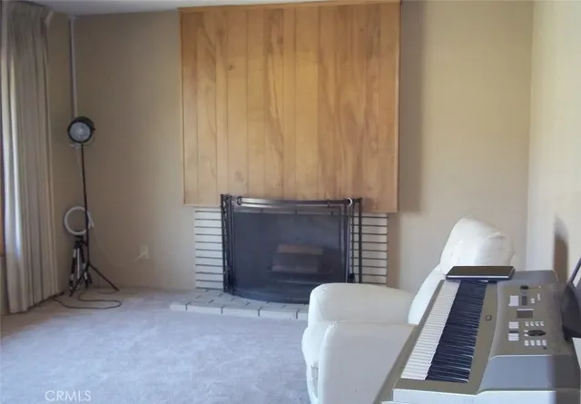 a view of a livingroom with furniture and a window