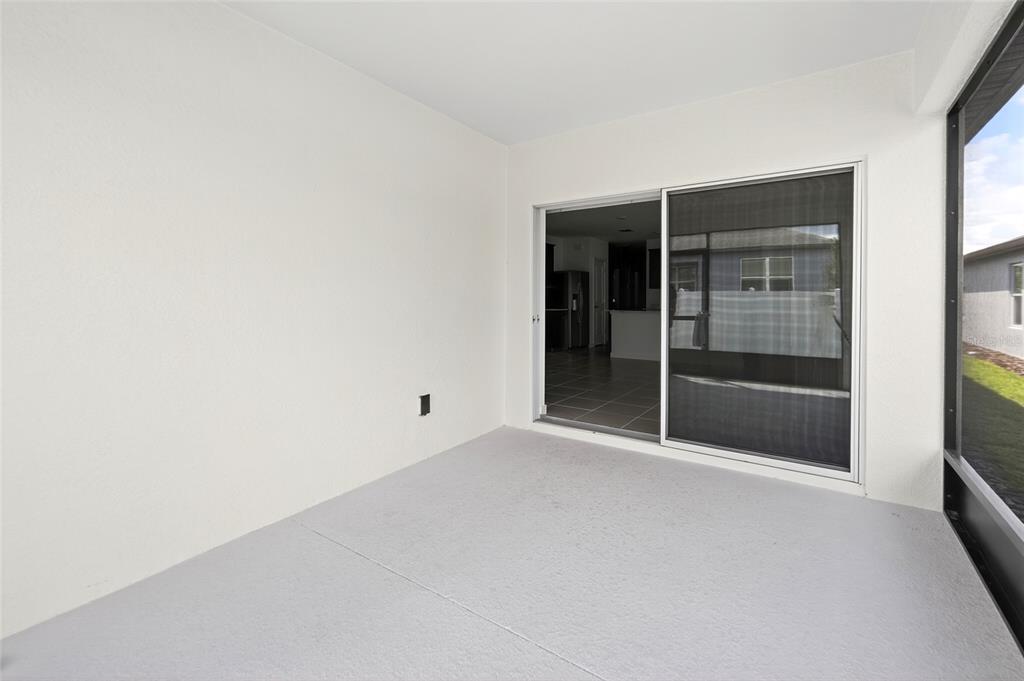 6784 Southwest 90th Loop Ocala, FL 34476 - Photo 11 of 11 a view of an empty room with a window