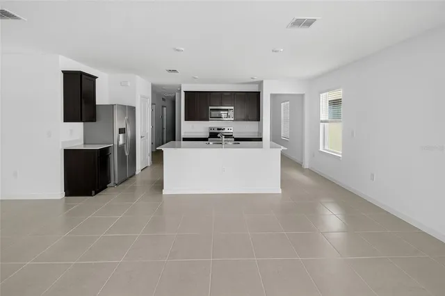 a living room with a couch and a flat screen tv