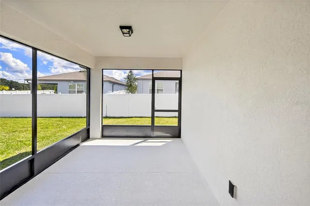 a view of an empty room with a large window