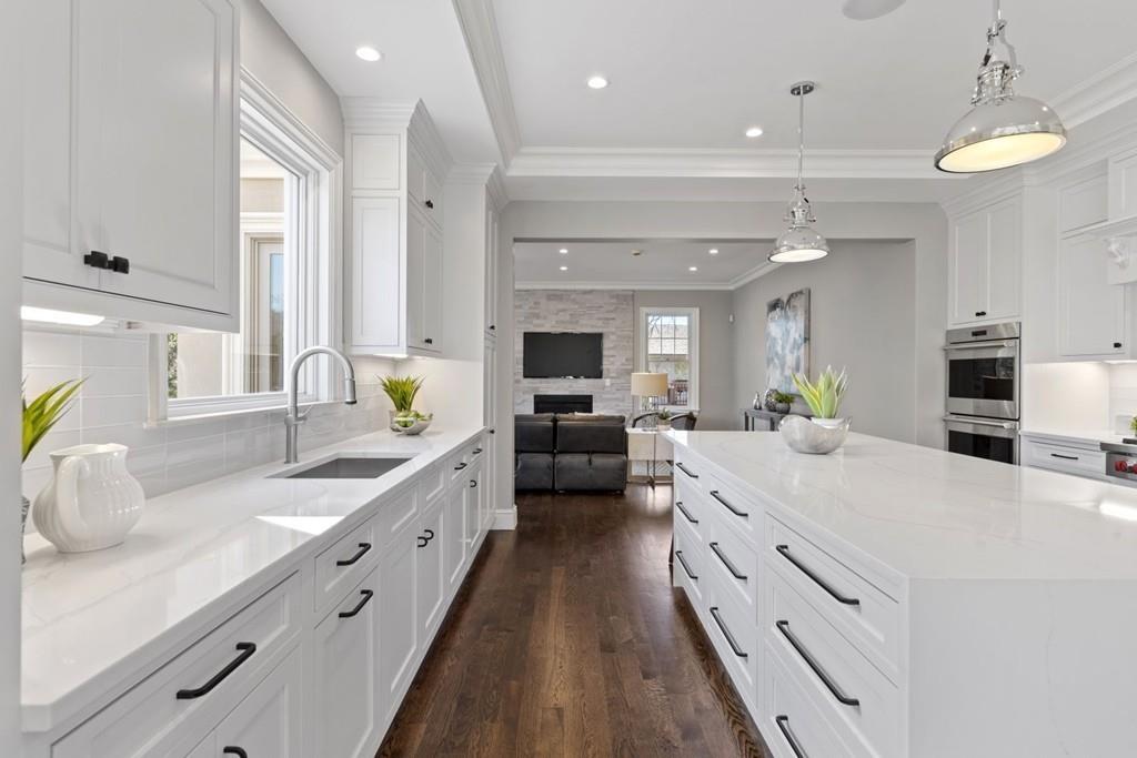 11 Fairhaven Road Newton, MA 02459 - Photo 14 of 40 a large white kitchen with a large window and stainless steel appliances