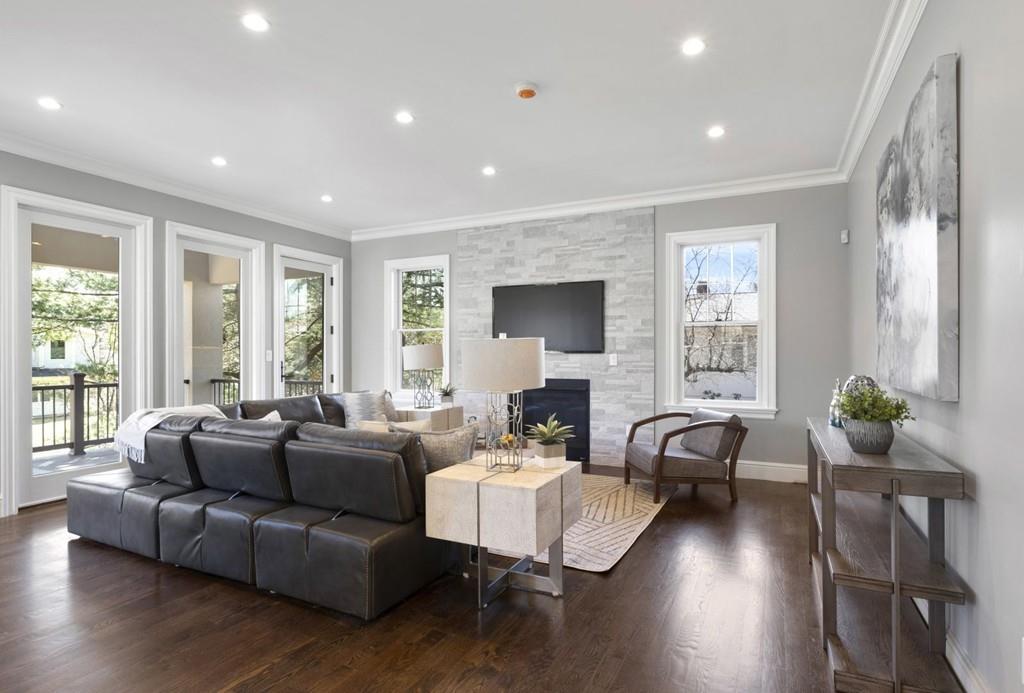 11 Fairhaven Road Newton, MA 02459 - Photo 21 of 40 a living room with furniture wooden floor and a large window