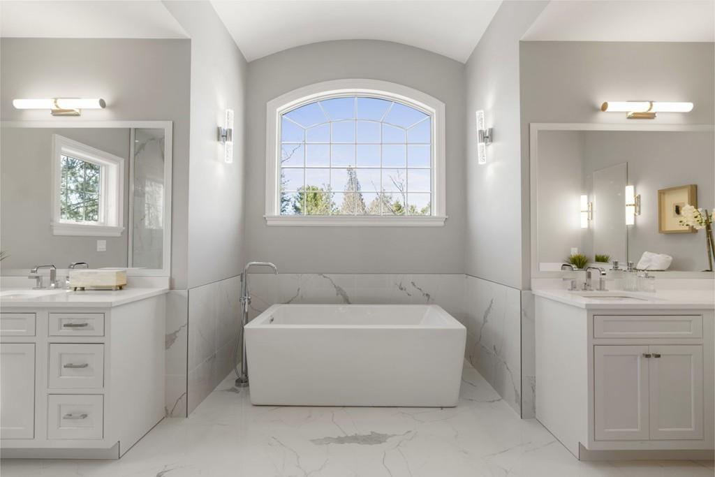 11 Fairhaven Road Newton, MA 02459 - Photo 29 of 40 a bathroom with a tub a sink and mirror