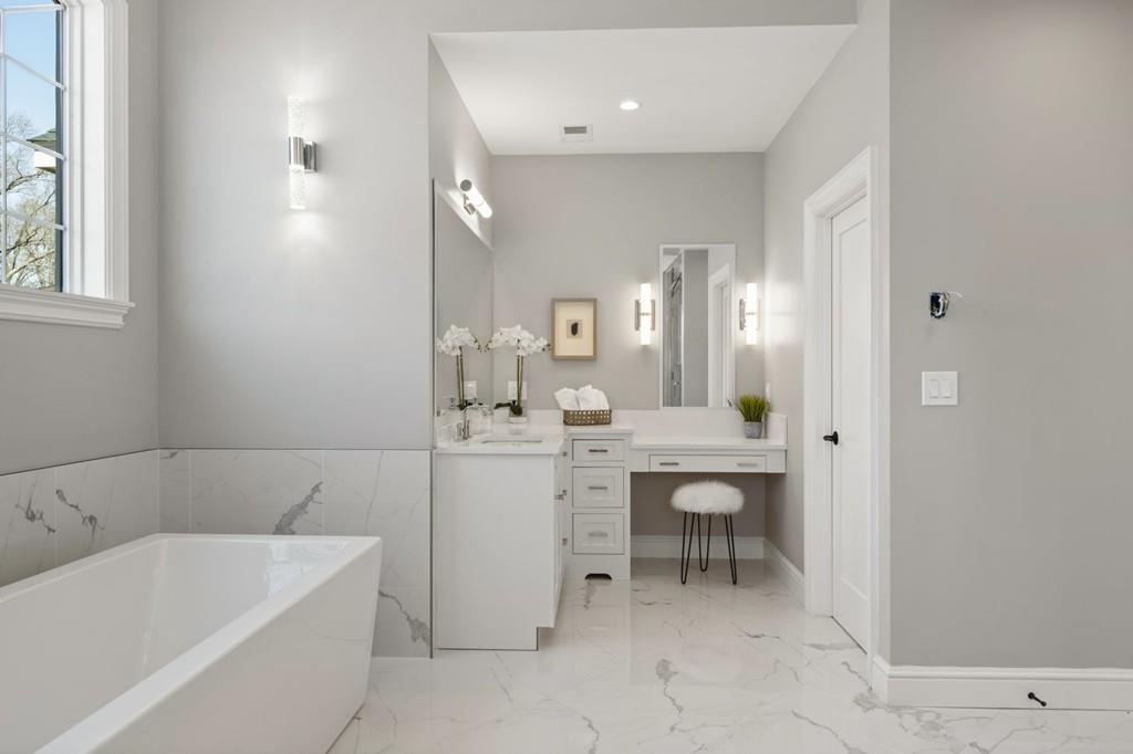 11 Fairhaven Road Newton, MA 02459 - Photo 30 of 40 a bathroom with a tub a sink and a mirror