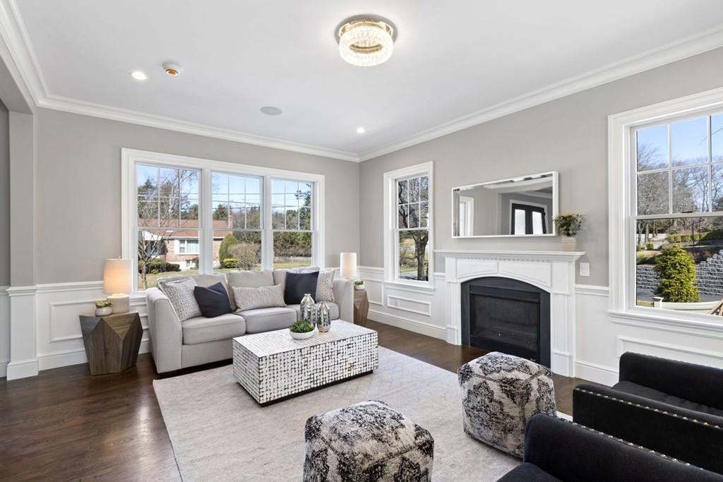 11 Fairhaven Road Newton, MA 02459 - Photo 5 of 40 a living room with furniture and a fireplace