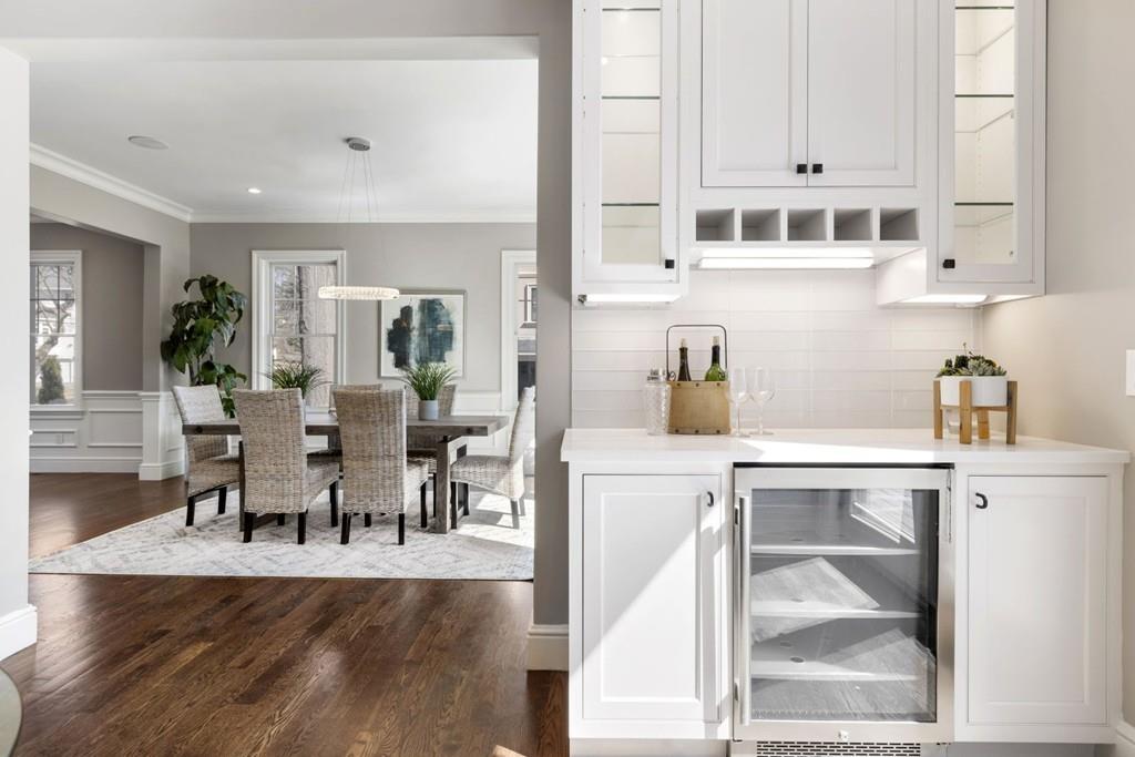 11 Fairhaven Road Newton, MA 02459 - Photo 9 of 40 a living room with furniture and a dining table with kitchen view