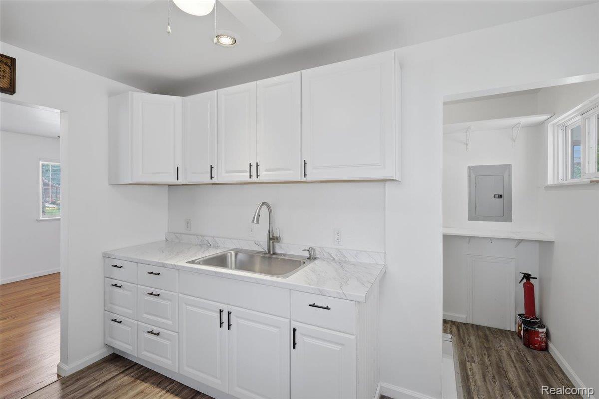5307 Drayton Road Clarkston, MI 48346 - Photo 16 of 46 White shaker-style cabinetry with matte black hardware