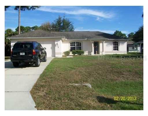 4254 Cynthia Terrace North Port, FL 34286 - Photo 1 of 5 a front view of a house with garden