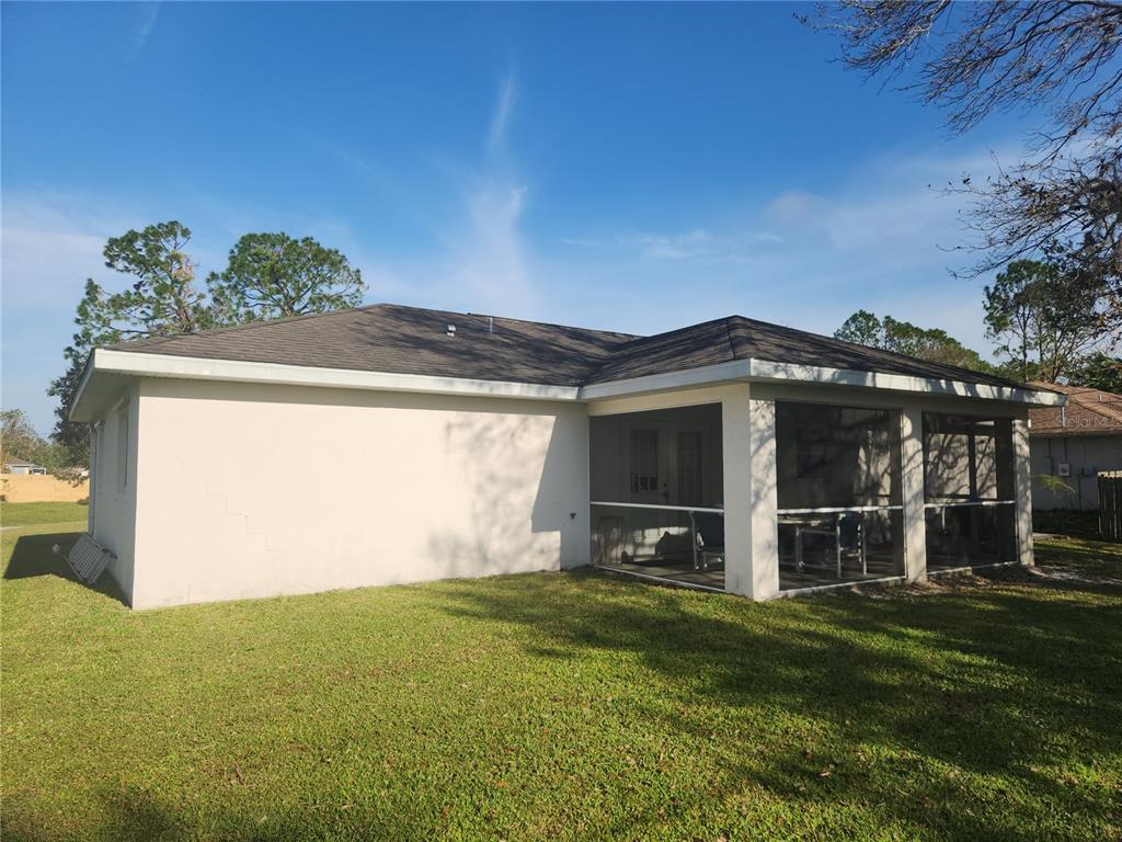 4254 Cynthia Terrace North Port, FL 34286 - Photo 2 of 5 a view of a front of a house with a yard