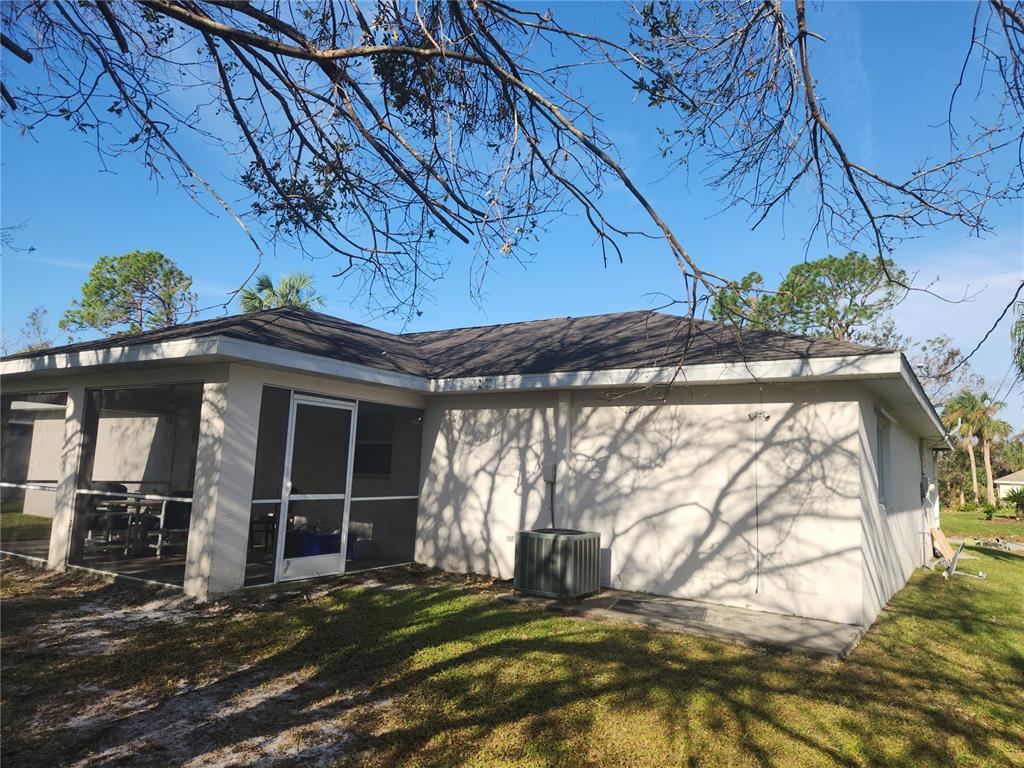 4254 Cynthia Terrace North Port, FL 34286 - Photo 3 of 5 a view of a house with a large window and a yard