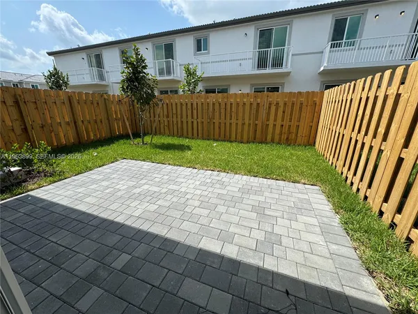 a view of a backyard with a garden