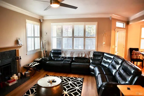a view of a livingroom with furniture and a window