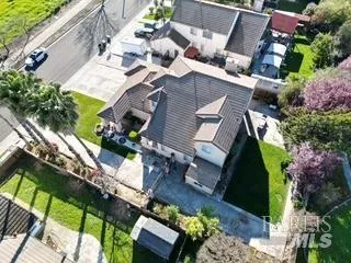 a aerial view of a house with garden space and street view