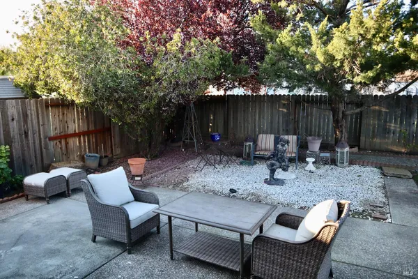 a view of a table and chairs in the patio