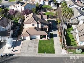 an aerial view of multiple houses with yard