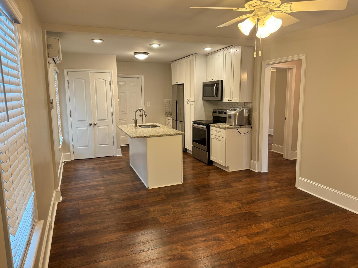 1218 Pender Street Raleigh, NC 27610 - Photo 13 of 21 a view of a kitchen with refrigerator and microwave