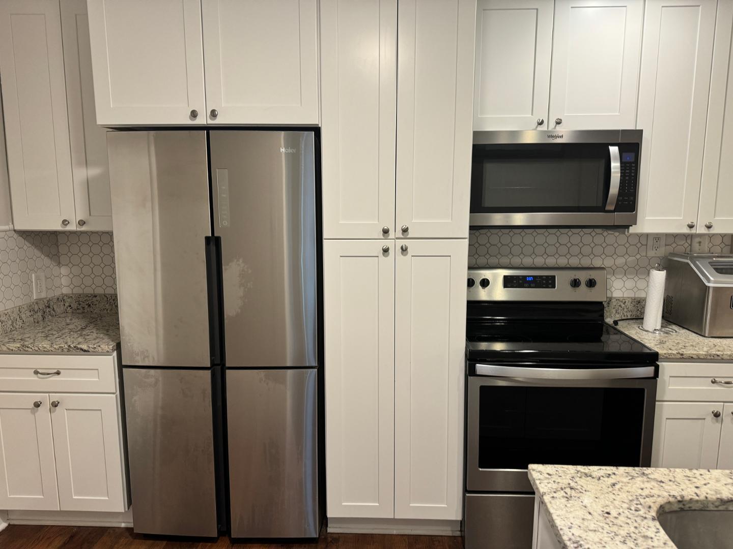 1218 Pender Street Raleigh, NC 27610 - Photo 15 of 21 a kitchen with stainless steel appliances a refrigerator stove and microwave