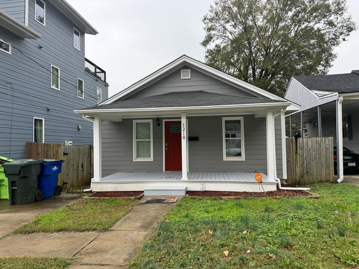 1218 Pender Street Raleigh, NC 27610 - Photo 2 of 21 front view of a house with a yard
