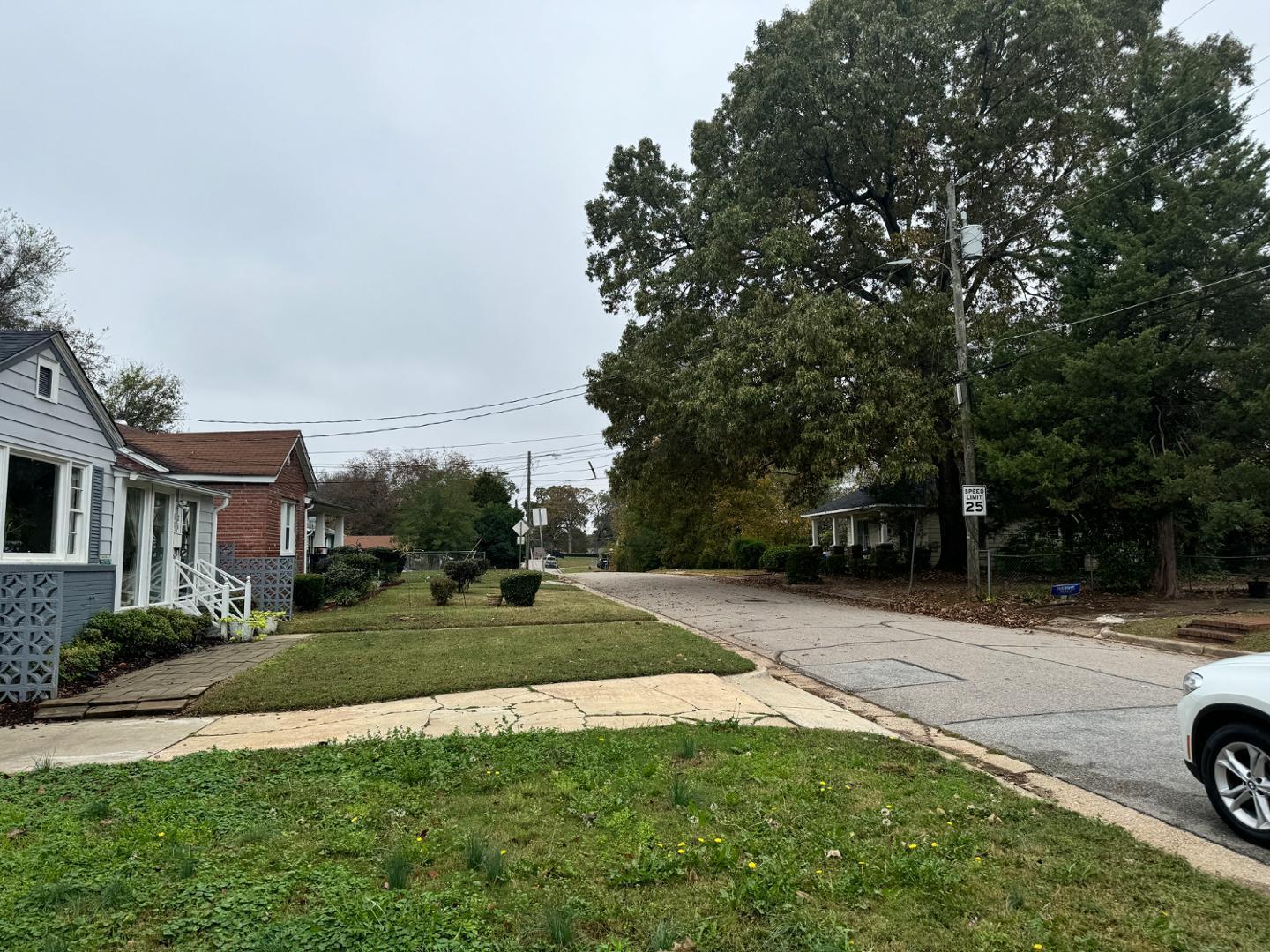 1218 Pender Street Raleigh, NC 27610 - Photo 3 of 21 a view of a street with a car parked in the background