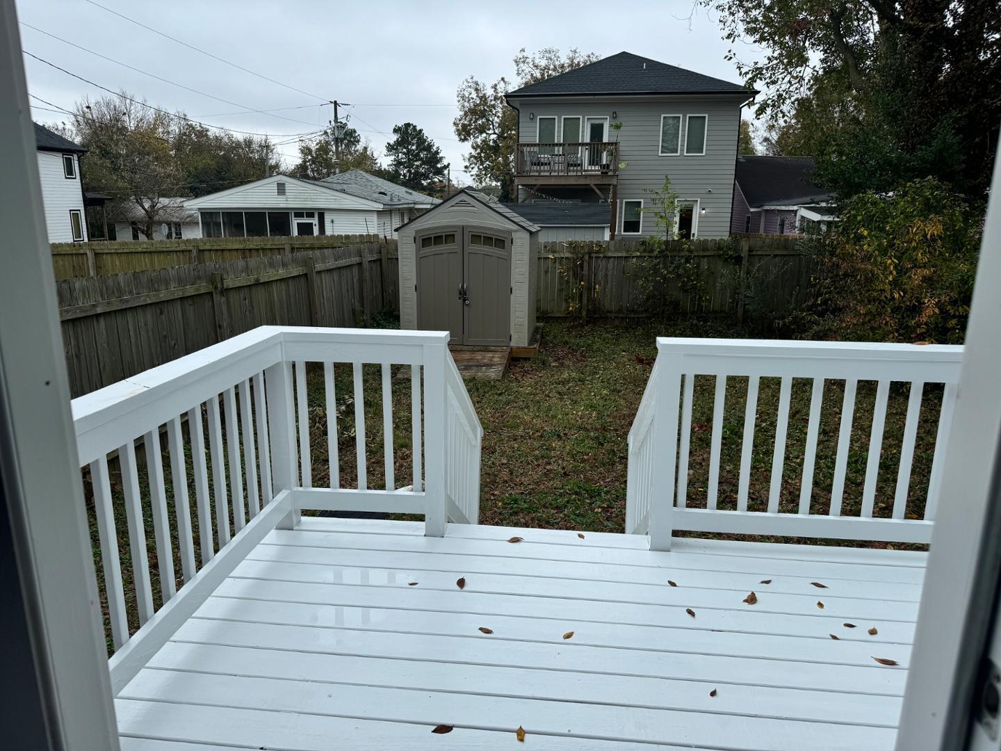 1218 Pender Street Raleigh, NC 27610 - Photo 7 of 21 a view of a house with wooden deck