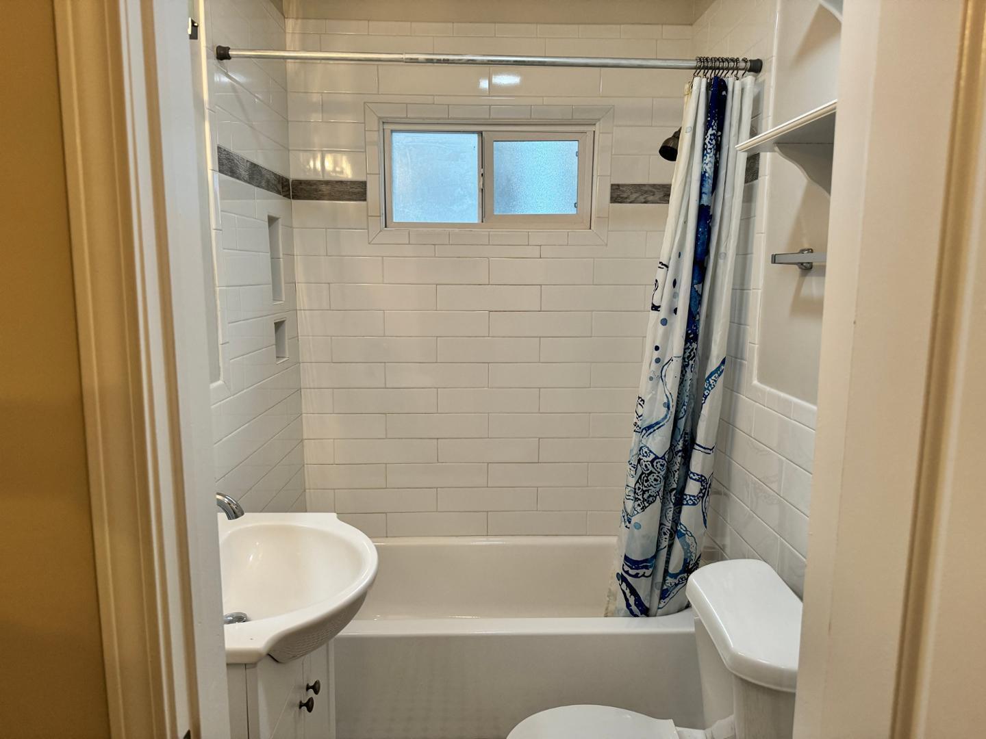 1218 Pender Street Raleigh, NC 27610 - Photo 9 of 21 a bathroom with a toilet and a shower
