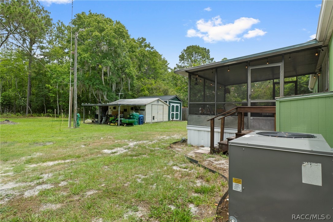 7927 West Cyprian Court Homosassa, FL 34448 - Photo 33 of 40 a front view of a house with a yard