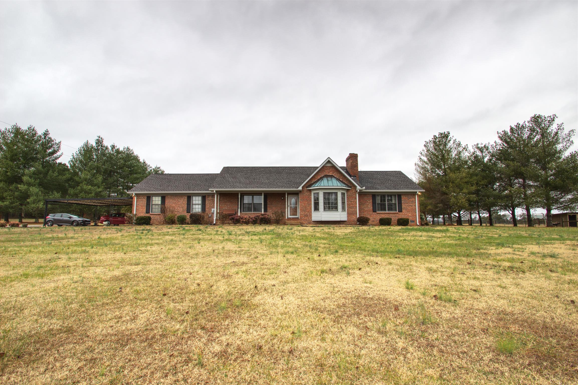 1240 McCrary Road Lebanon, TN 37090 - Photo 1 of 22 a front view of a house with a garden