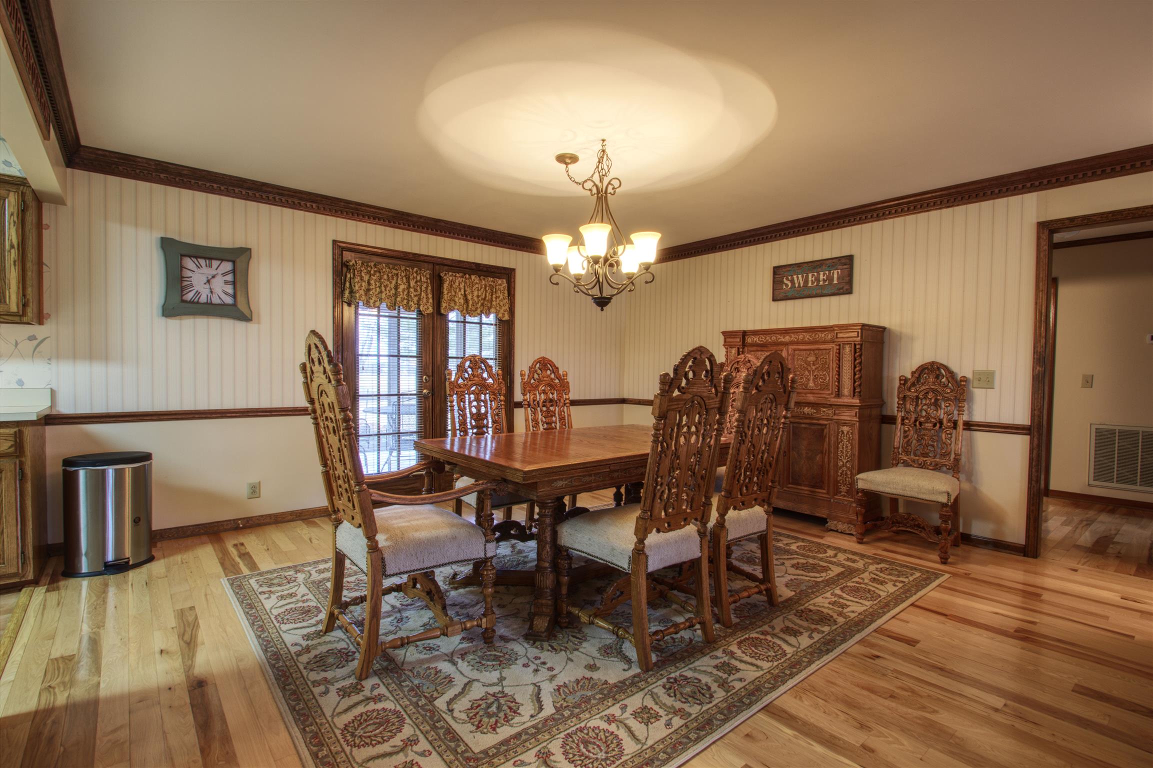 1240 McCrary Road Lebanon, TN 37090 - Photo 11 of 22 a dining room with furniture a chandelier and wooden floor