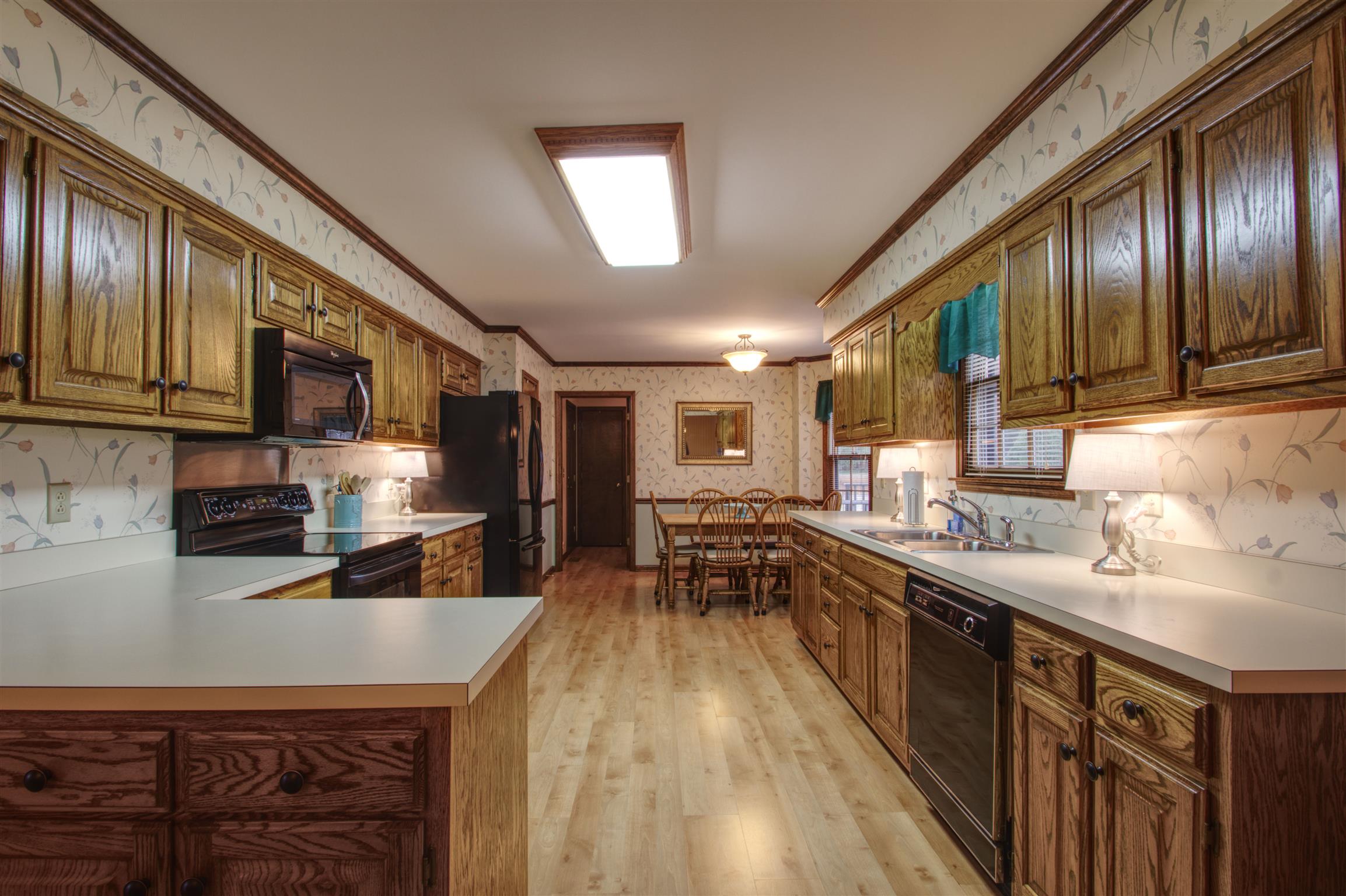 1240 McCrary Road Lebanon, TN 37090 - Photo 13 of 22 a kitchen with stainless steel appliances granite countertop a sink stove and cabinets