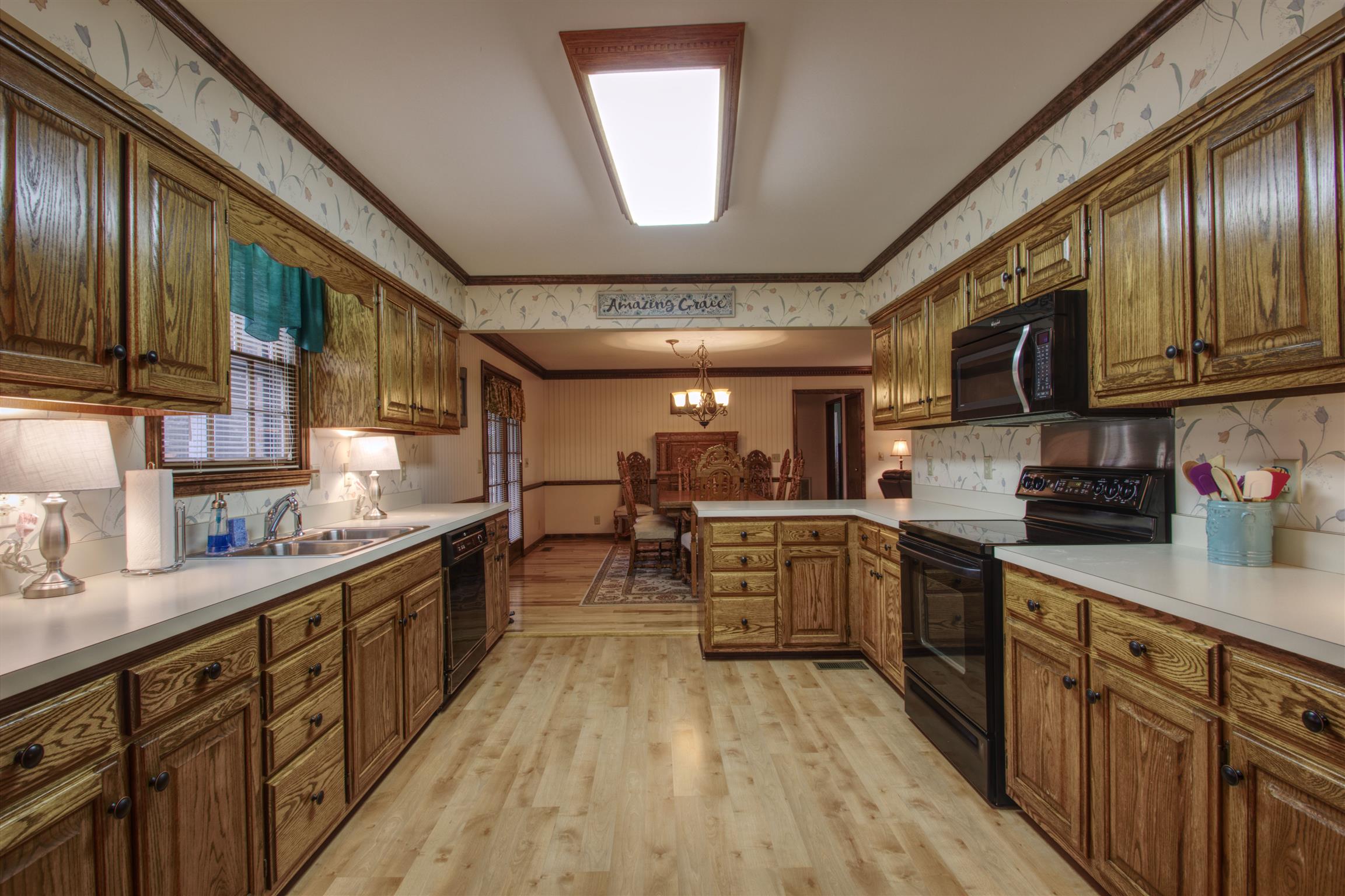 1240 McCrary Road Lebanon, TN 37090 - Photo 14 of 22 a kitchen with stainless steel appliances granite countertop lots of counter top space a sink and cabinets