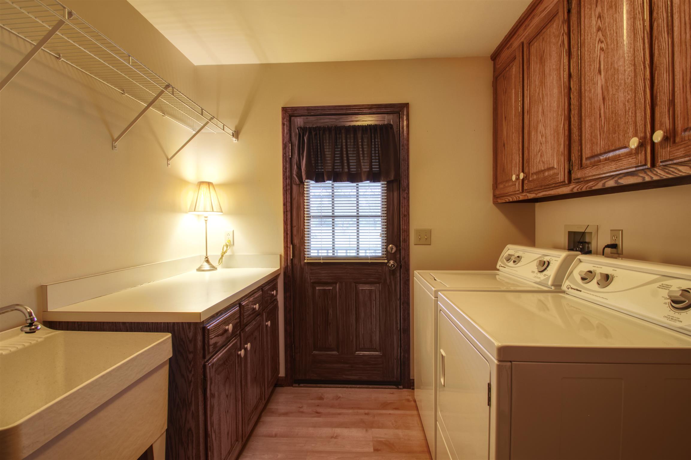 1240 McCrary Road Lebanon, TN 37090 - Photo 17 of 22 a utility room with a sink washer and dryer