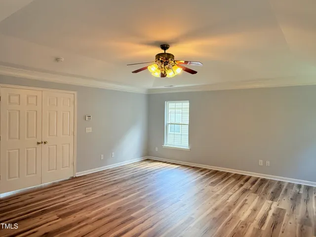 a view of a house with a yard and a large window