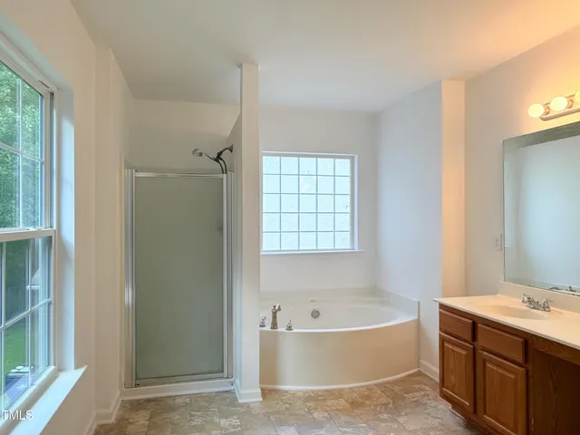 a view of a house with a yard and wooden floor