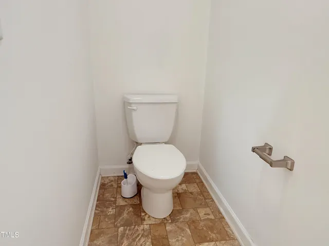 a view of a small yard and a large tree