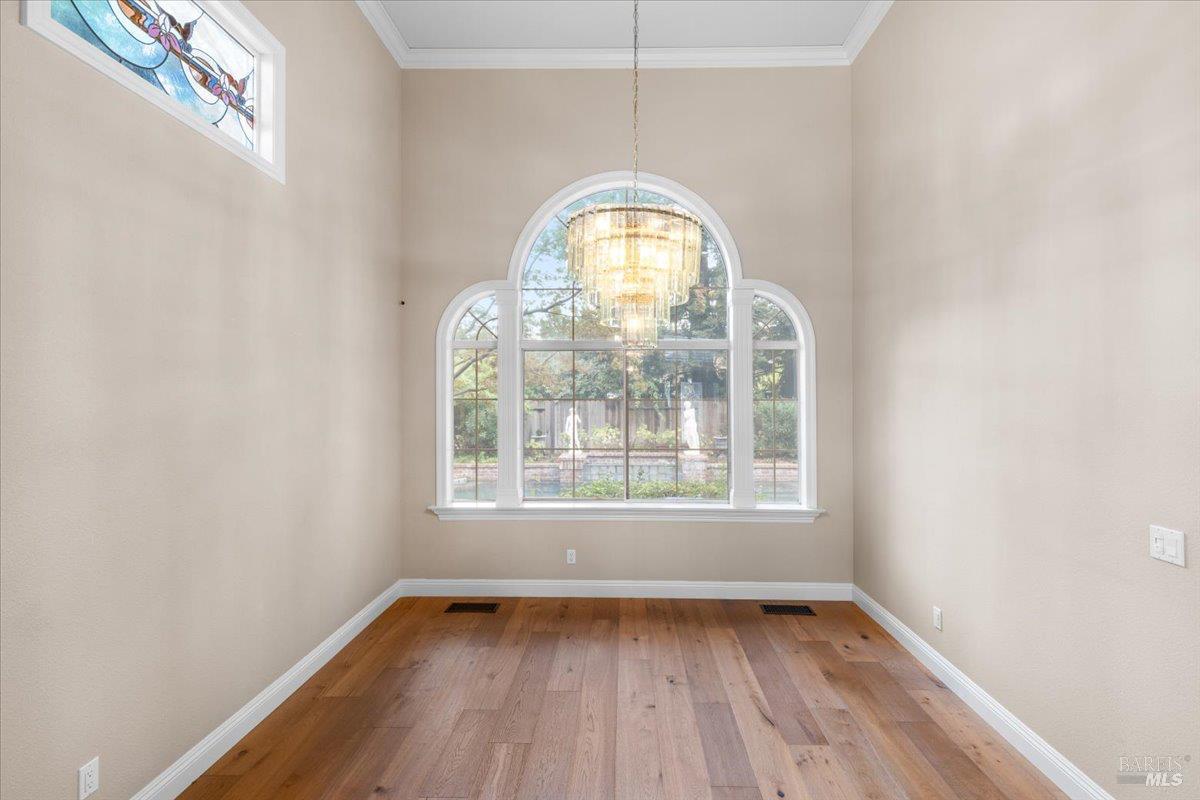 3229 Seminole Circle Fairfield, CA 94534 - Photo 11 of 73 an empty room with wooden floor and windows