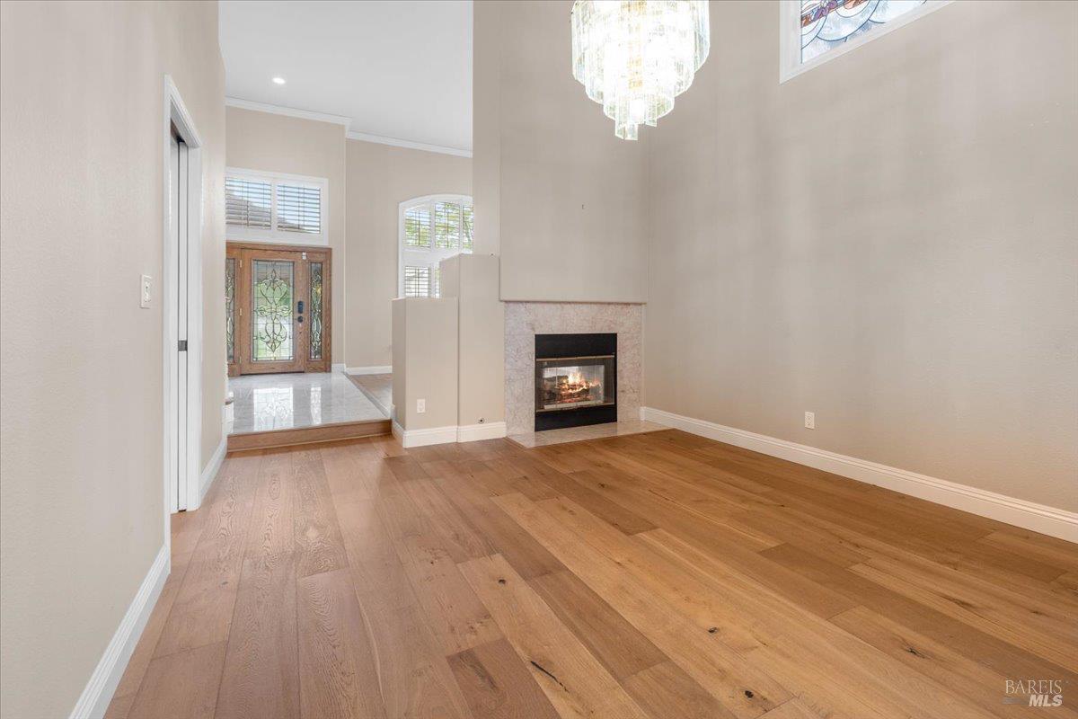 3229 Seminole Circle Fairfield, CA 94534 - Photo 12 of 73 wooden floor chandelier and windows in an empty room