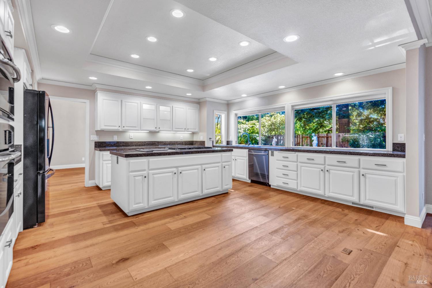 3229 Seminole Circle Fairfield, CA 94534 - Photo 14 of 73 a large kitchen with stainless steel appliances kitchen island a large counter top and a wooden floors