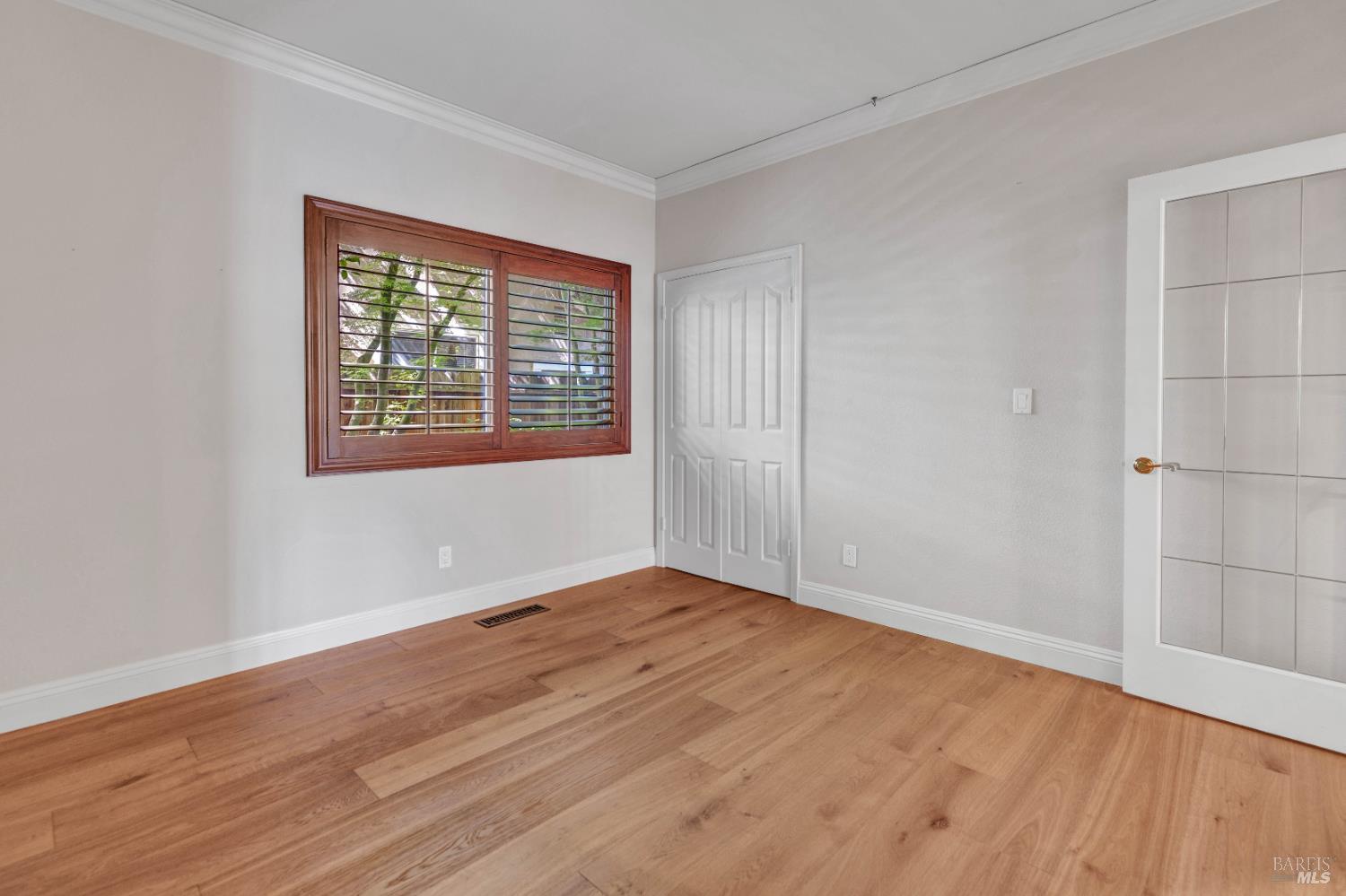 3229 Seminole Circle Fairfield, CA 94534 - Photo 28 of 73 an empty room with wooden floor and windows