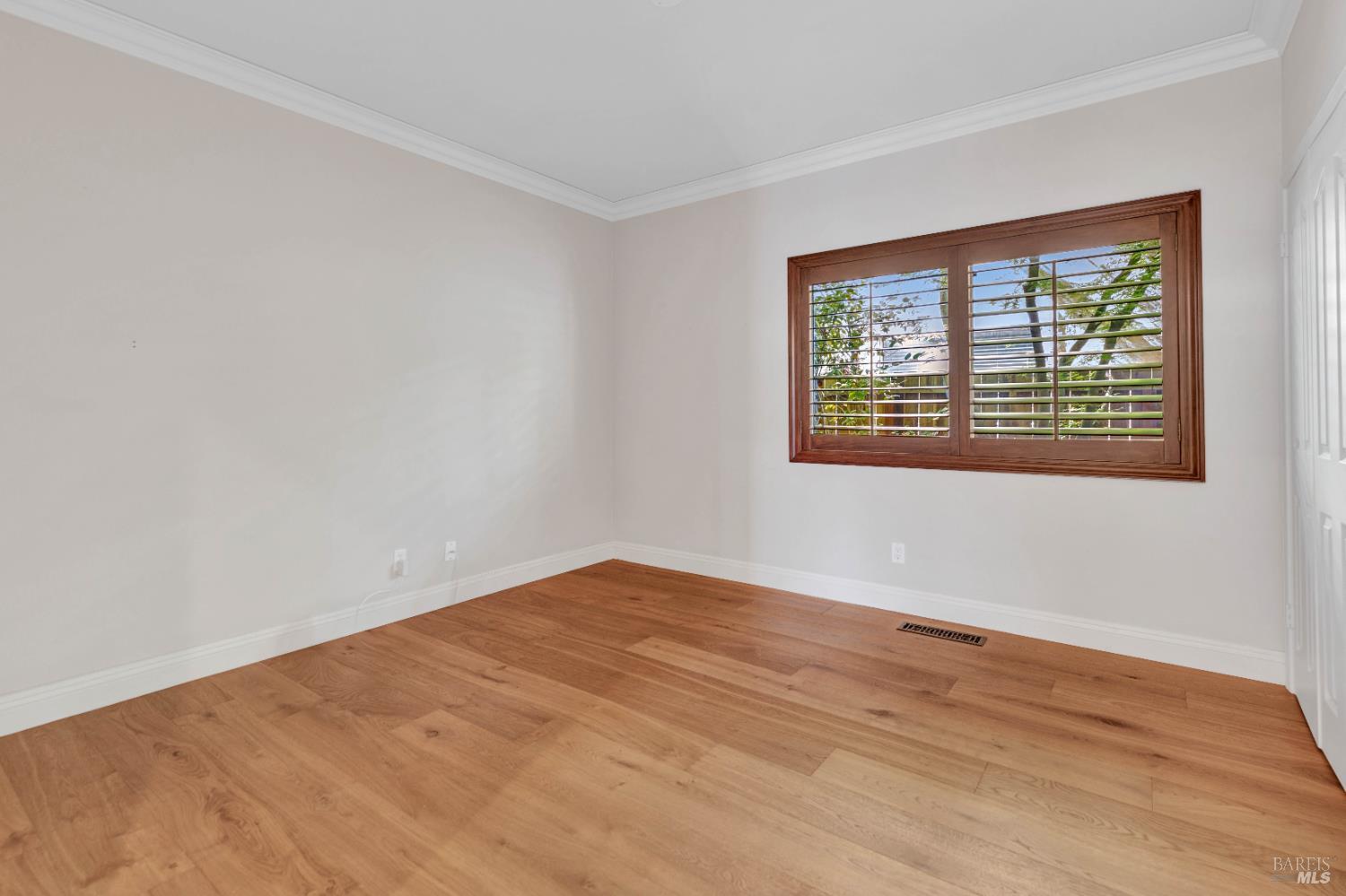 3229 Seminole Circle Fairfield, CA 94534 - Photo 29 of 73 a view of an empty room with wooden floor and a window