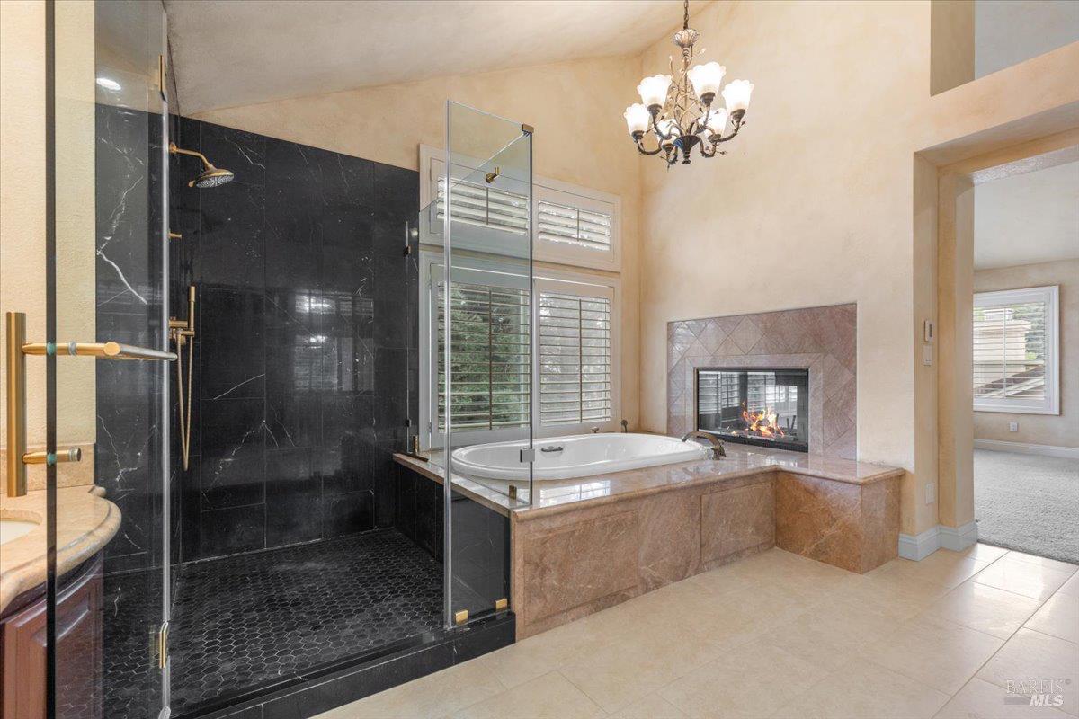 3229 Seminole Circle Fairfield, CA 94534 - Photo 36 of 73 a spacious bathroom with a granite countertop tub shower and mirror